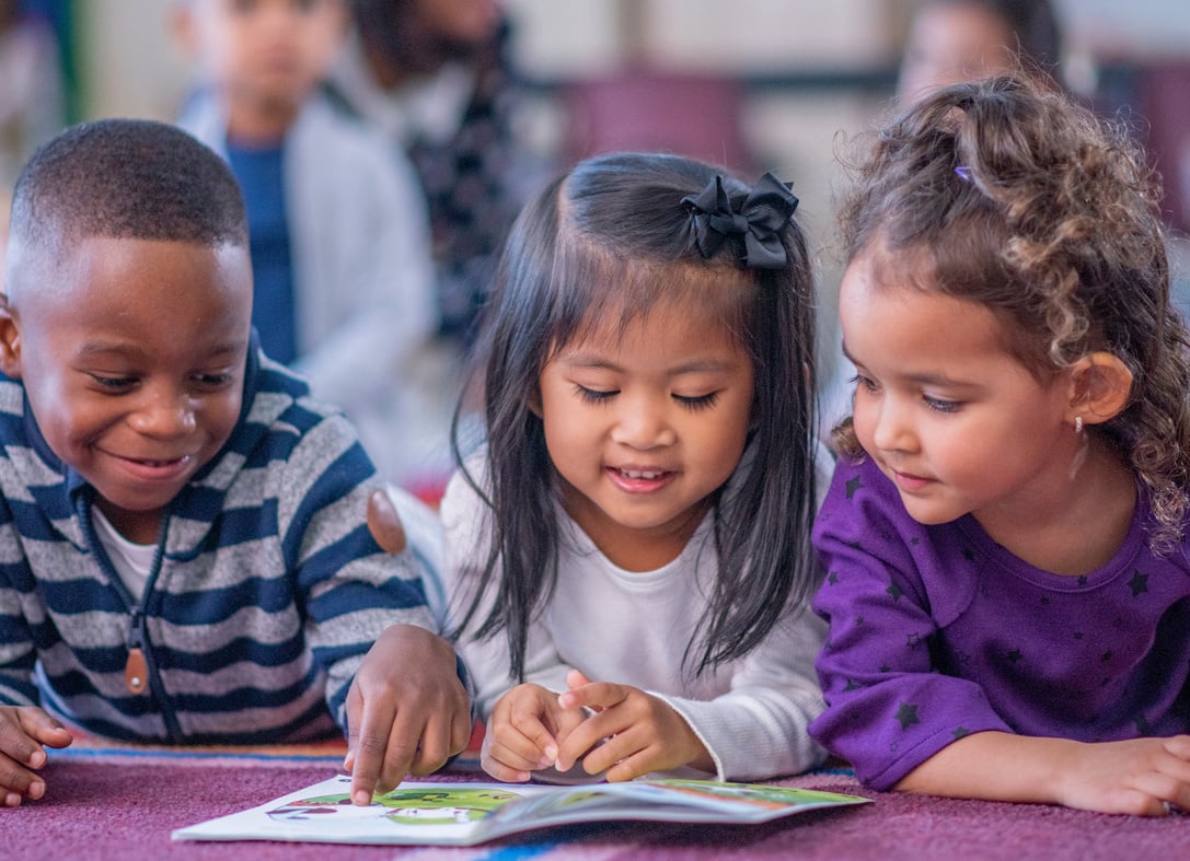 Daycare Children Reading Together stock photo